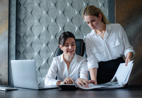 young-business-lady-female-director-sitting-office-desk-working-process-business-meeting-working-with-colleague-solving-business-tasks-office-collective-concept.jpg